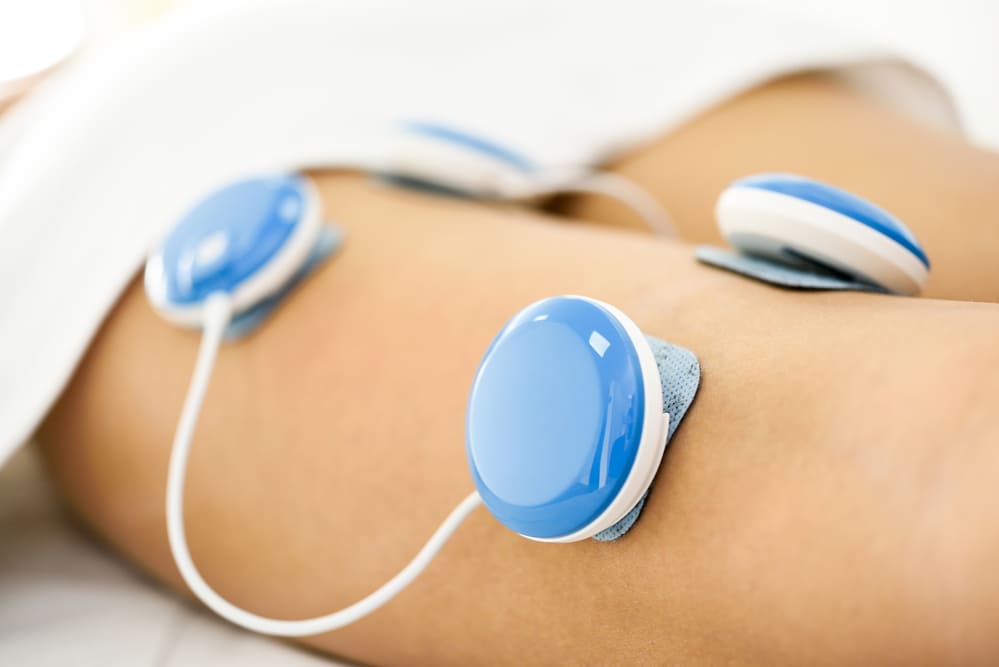 electroestimulación fisioterapia pierna mujer